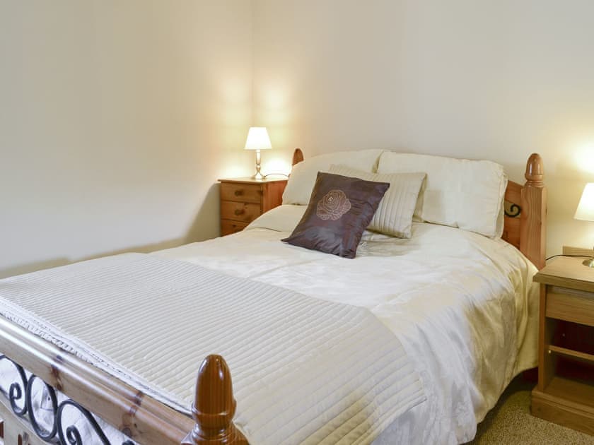 Family bedroom with a double and two single beds | The Granary - Rousland Cottages, Linlithgow
