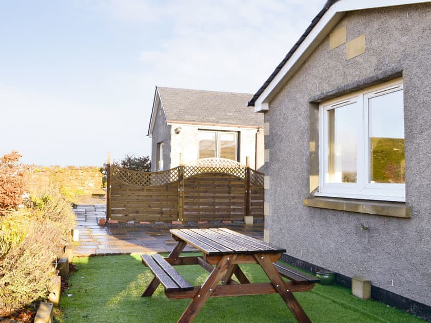 Patio area with outdoor furniture | The Granary - Rousland Cottages, Linlithgow