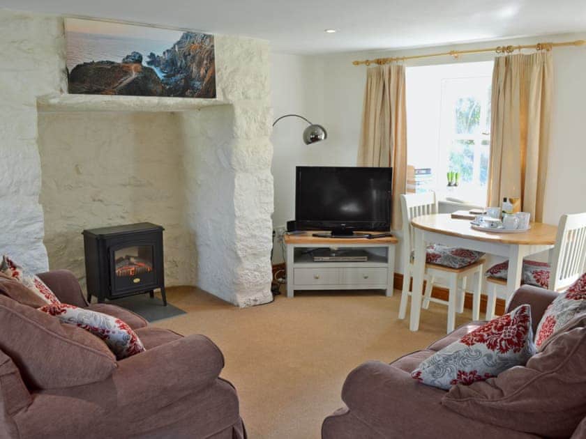 Charming living/dining room with cosy wood burner | Woodford Cottage, Rosudgeon, near Penzance