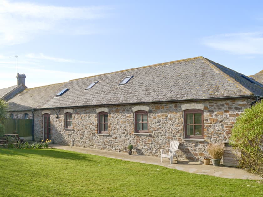 Rear garden with patio area  | Goose Cottage - Quinceborough Farm, Widemouth Bay, near Bude