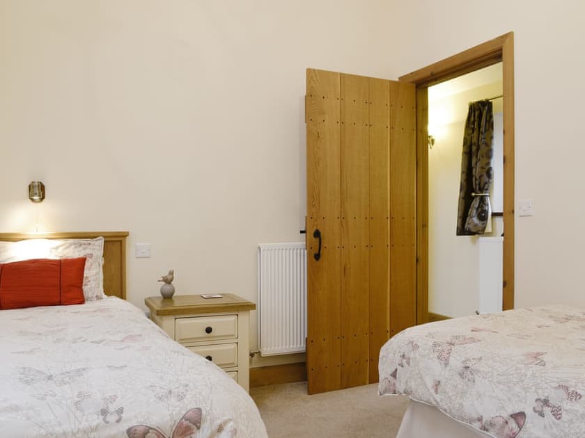 Good-sized twin bedroom | The Old Byre - West House Farm, Dearham, near Maryport