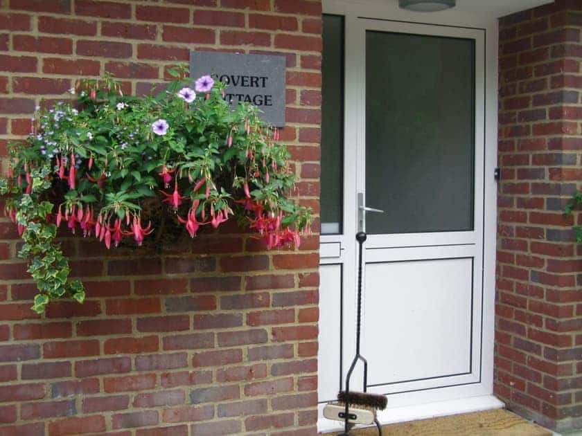 Florally decorated main entrance | Covert Cottage, Diss