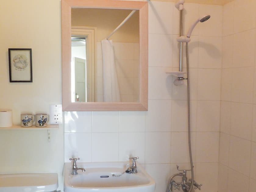 Bathroom with shower over the bath | Deer Park Lookout, Gunton Park, near Hanworth 