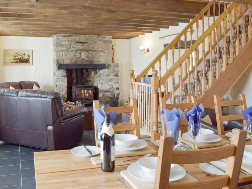 Characterful living/ dining room with beamed ceiling | Bryntowy - Tanylan Farm Cottages, Kidwelly