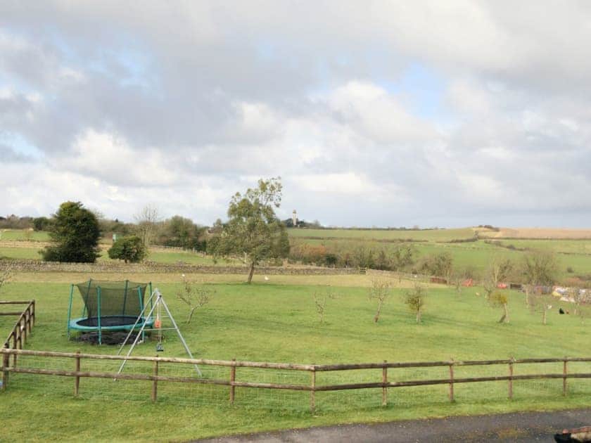 Wonderful far-reaching views over the paddock-style garden | The Pump House, Hawkesbury Upton