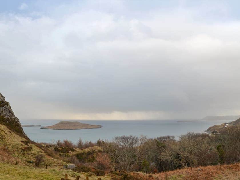 Views across open countryside towards the waters of Staffin Bay | Seascape, Staffin