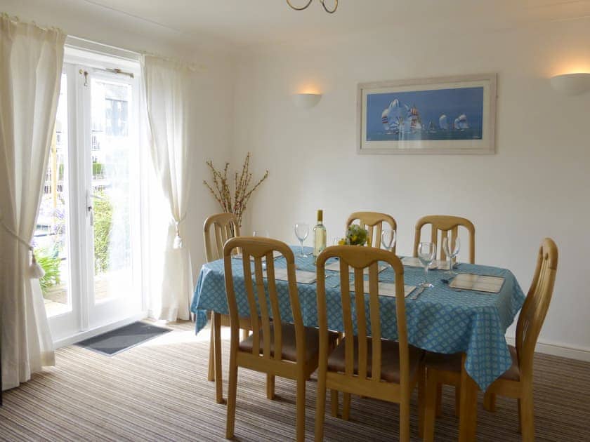 Living/dining room with patio doors | Spinnakers, Falmouth