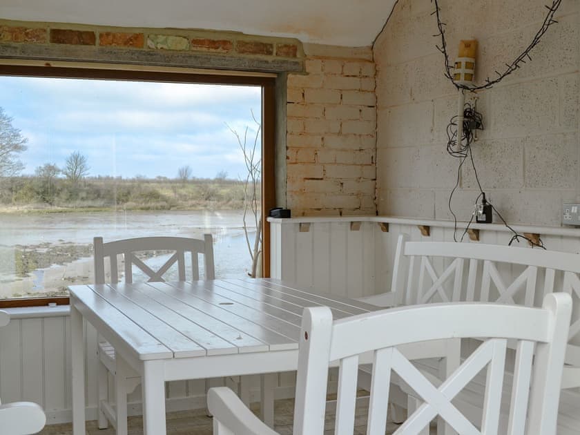 Jetty cottage looking directly over the bay - ideal for dining,  | The Maltings, Near Bamburgh