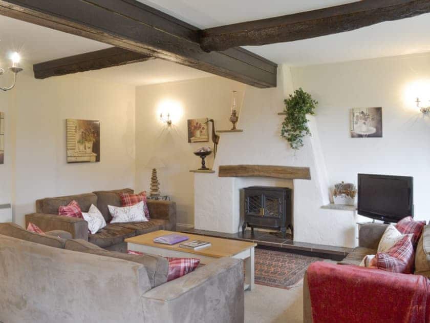 Characterful living room with exposed wood beams | Dray Cottage, East Allington, near Totnes