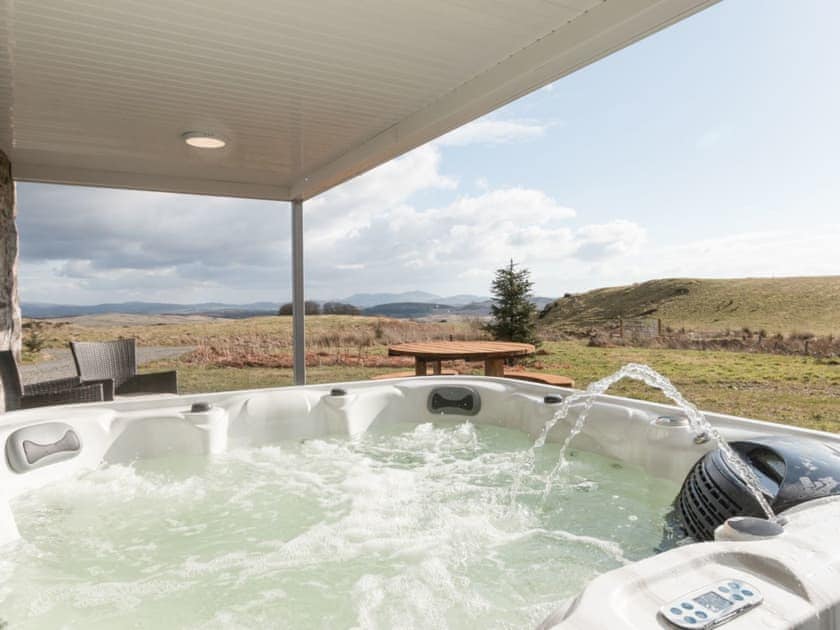 Relaxing hot tub with amazing views | Cot Cottage, Ringford, near Castle Douglas