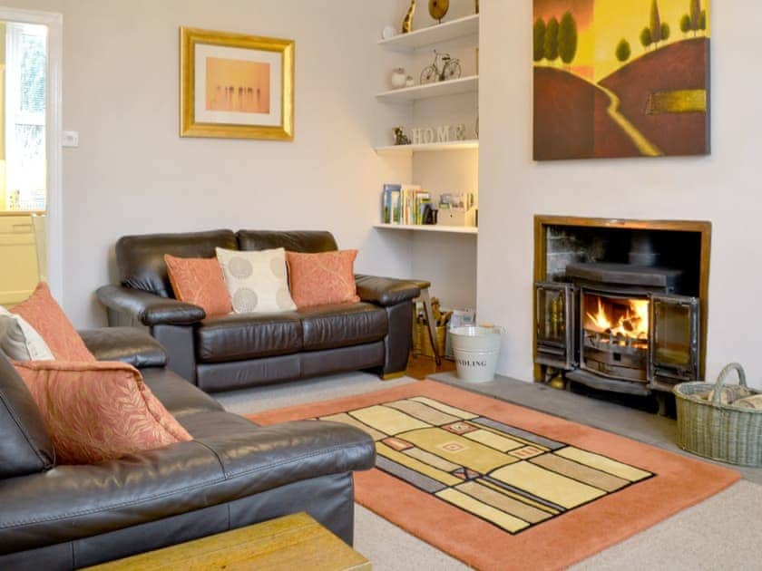 Comfortable living room with a cosy wood burner | Poppy Cottage, Hebden, near Grassington