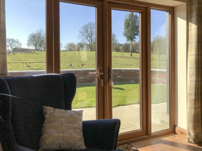 Patio doors leading to courtyard | Chick Hatch Barn, Carlton, near Saxmundham