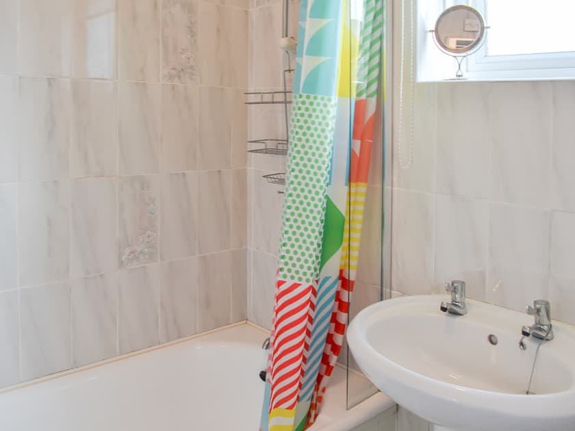 Bathroom with shower over the bath | Fairways, Beadnell, near Seahouses