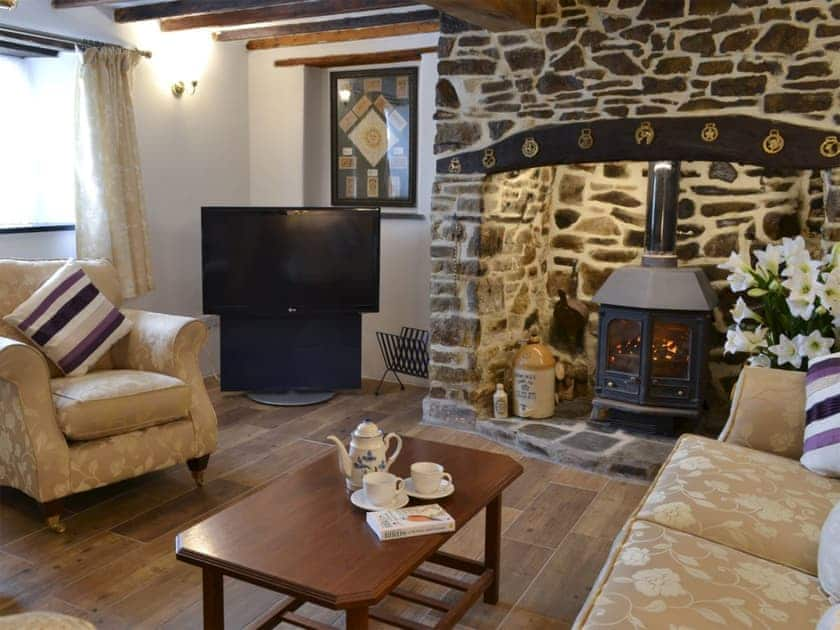 Comfortable living room with beams | Knotty Corner Cottage, Fairy Cross, near Bideford