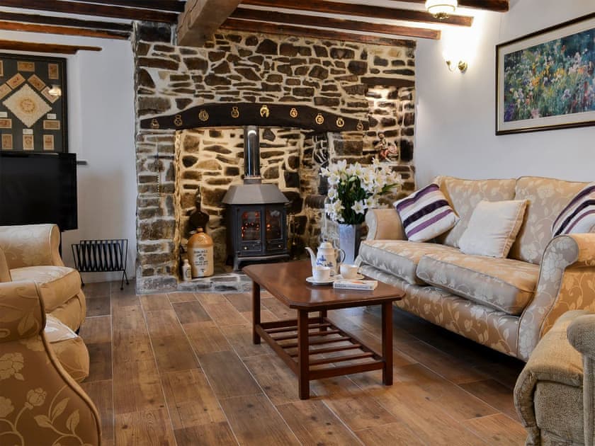 Comfortable living room with beams | Knotty Corner Cottage, Fairy Cross, near Bideford