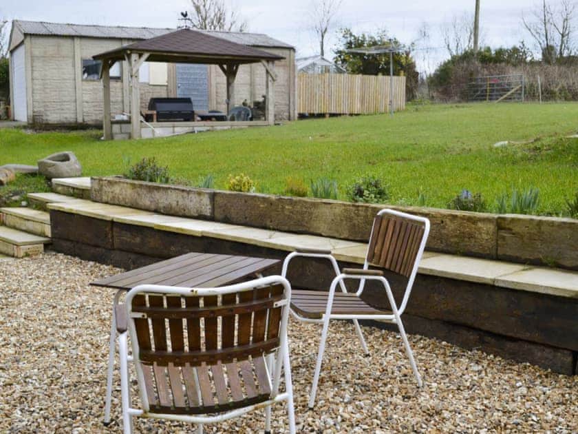 Large garden with patio, garden furniture and gas barbecue | Knotty Corner Cottage, Fairy Cross, near Bideford