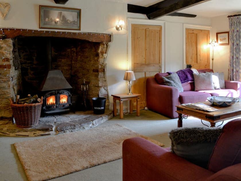 Living room with wood burner | Churchtown Farm Cottage, West Anstey