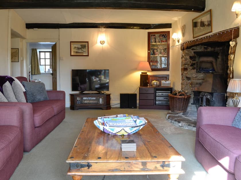 Living room with wood burner | Churchtown Farm Cottage, West Anstey
