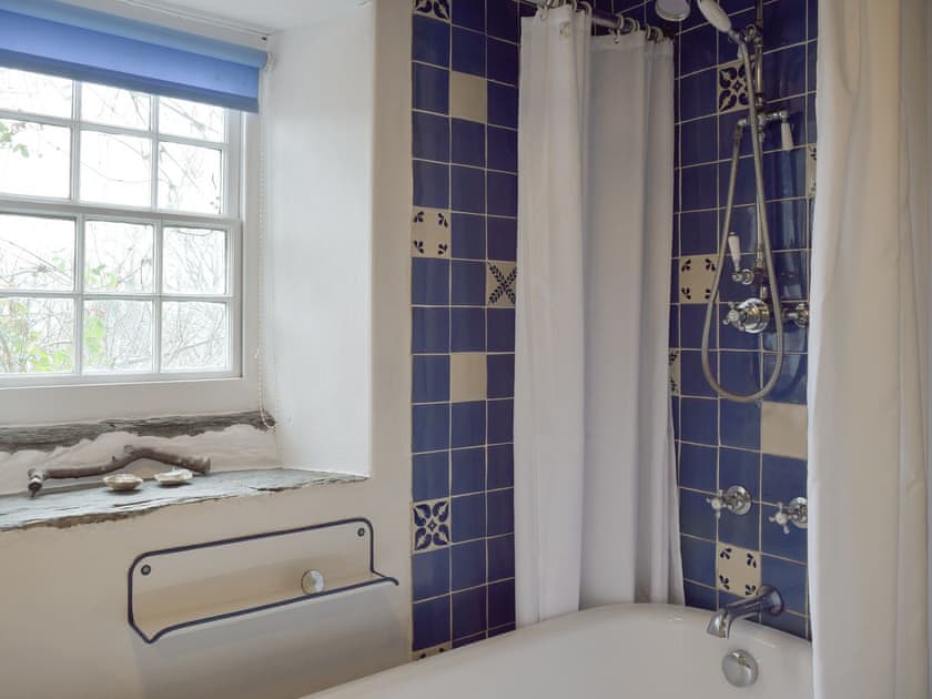 Ground floor bathroom with shower over bath | 2 Penrhiw, Abercych, near Newcastle Emlyn