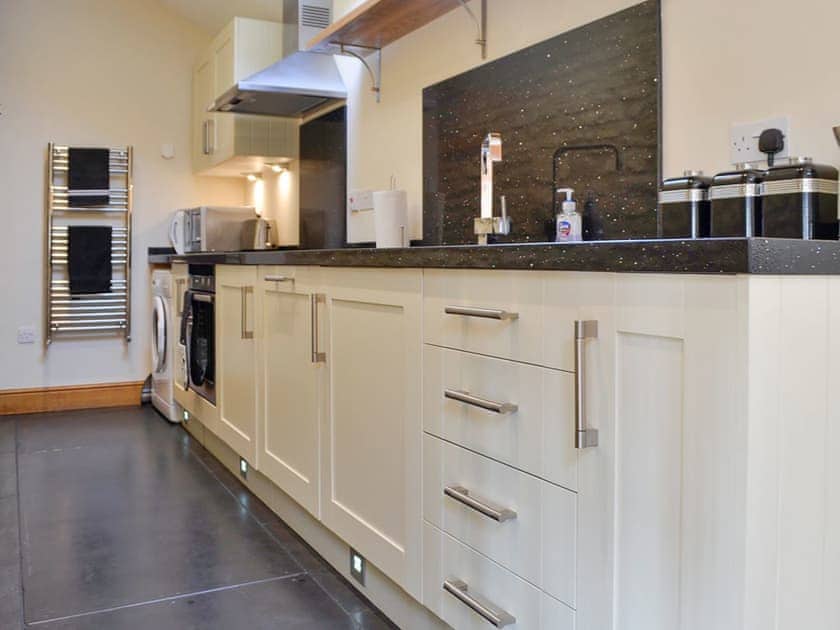 Well-appointed galley style kitchen | Stratton Mill, Cirencester