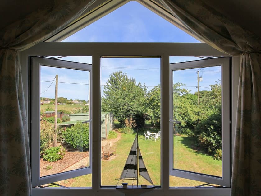 Wonderful view of the garden and the surrounding area from the first floor bedroom | Woodside Cottage, Sandford, near Shanklin
