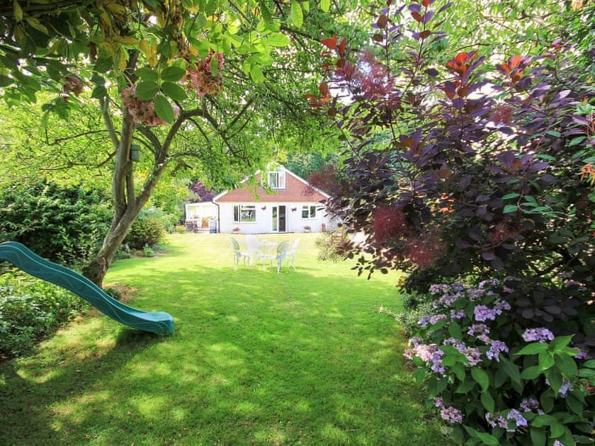 Extensive garden with mature shrubs and trees | Woodside Cottage, Sandford, near Shanklin
