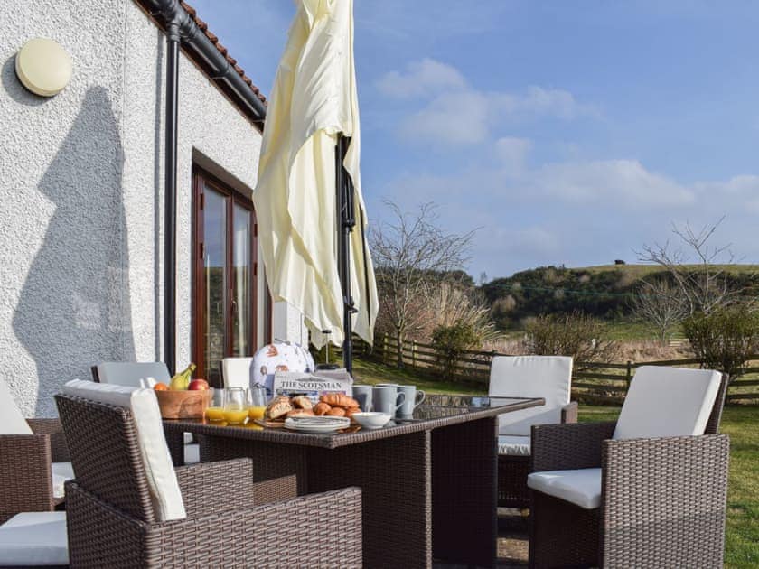 Sunny patio with outdoor furniture | The Roundel, Balmullo, near St Andrews