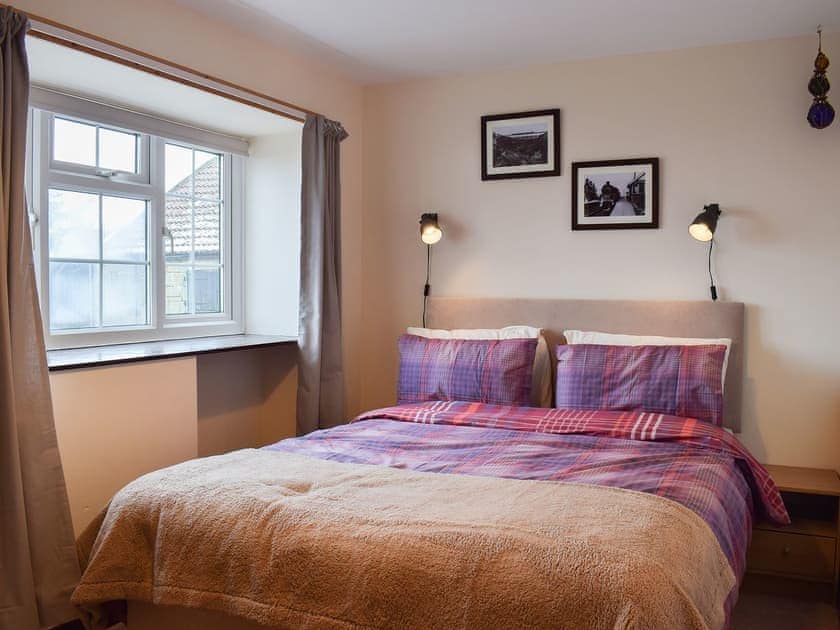Cosy and inviting double bedroom with kingsize bed  | Sycamore Cottage, Borrowby, near Staithes