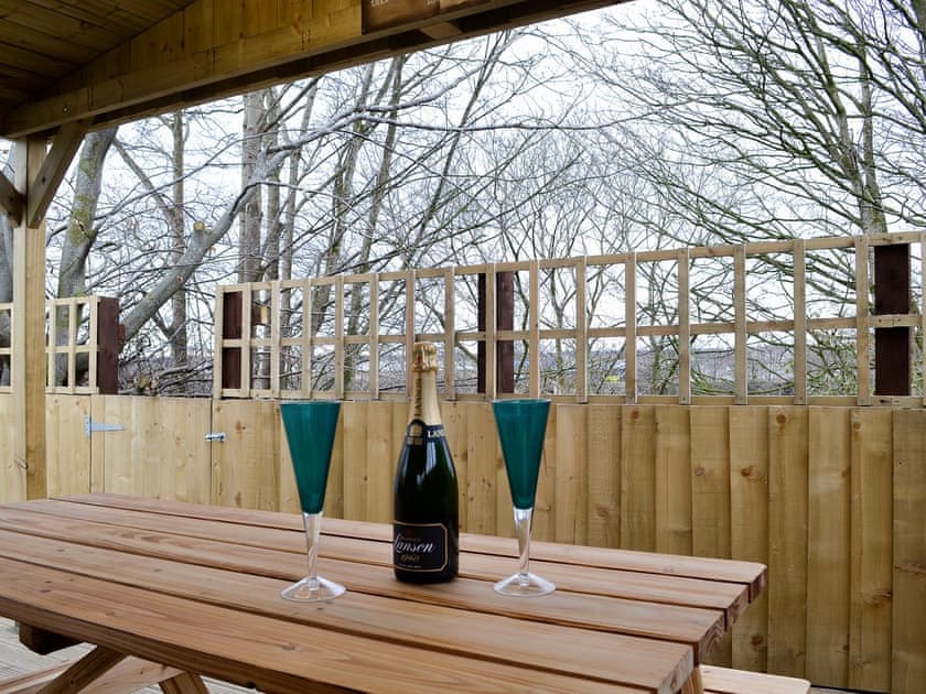 Outside decked area for relaxing with direct access to the river | Key to the Esk, Longtown, near Carlisle