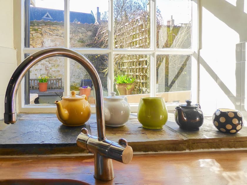 Delightful sunny traditional kitchen overlooking the courtyard garden  | Forge View Cottage, Thornton-le-Dale, near Pickering