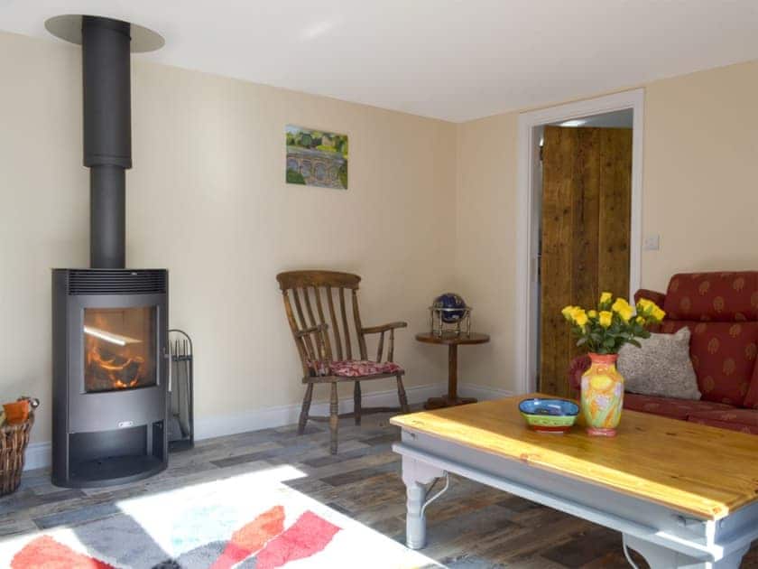 Cosy living area with wood burner | Snipelands Barn, Wedmore, near Glastonbury