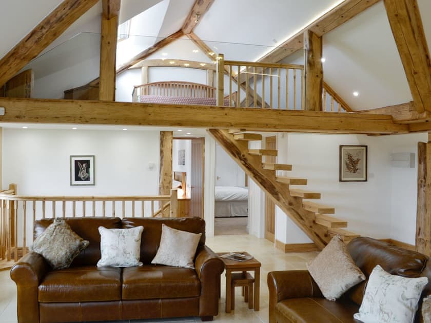 Attractive living area with mezzanine | Combe View - Lower North Radworthy Cottages, Heasley Mill, near South Molton