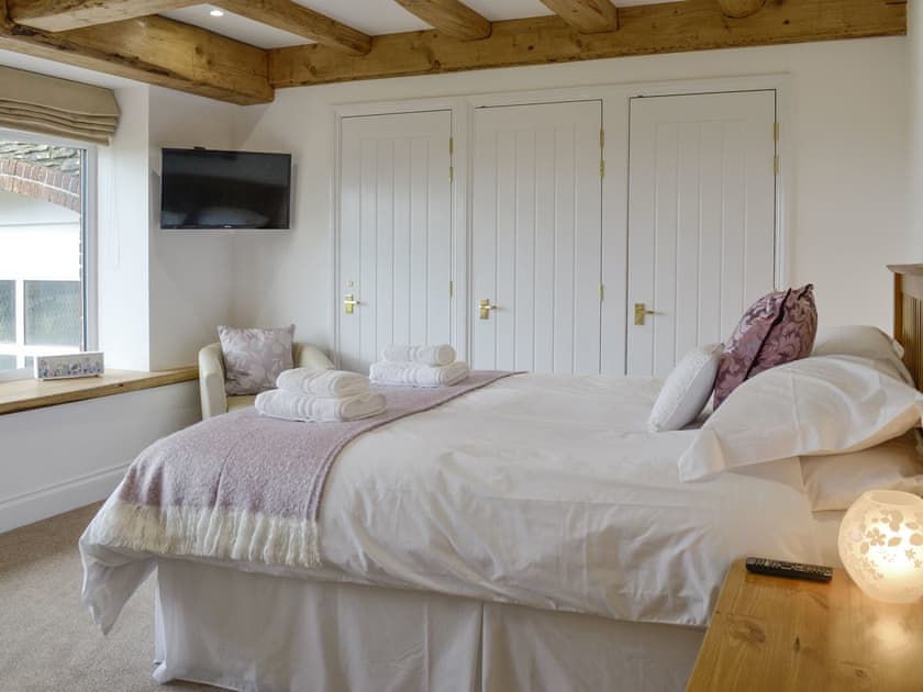 Relaxing double bedroom with en-suite bathroom | Combe View - Lower North Radworthy Cottages, Heasley Mill, near South Molton