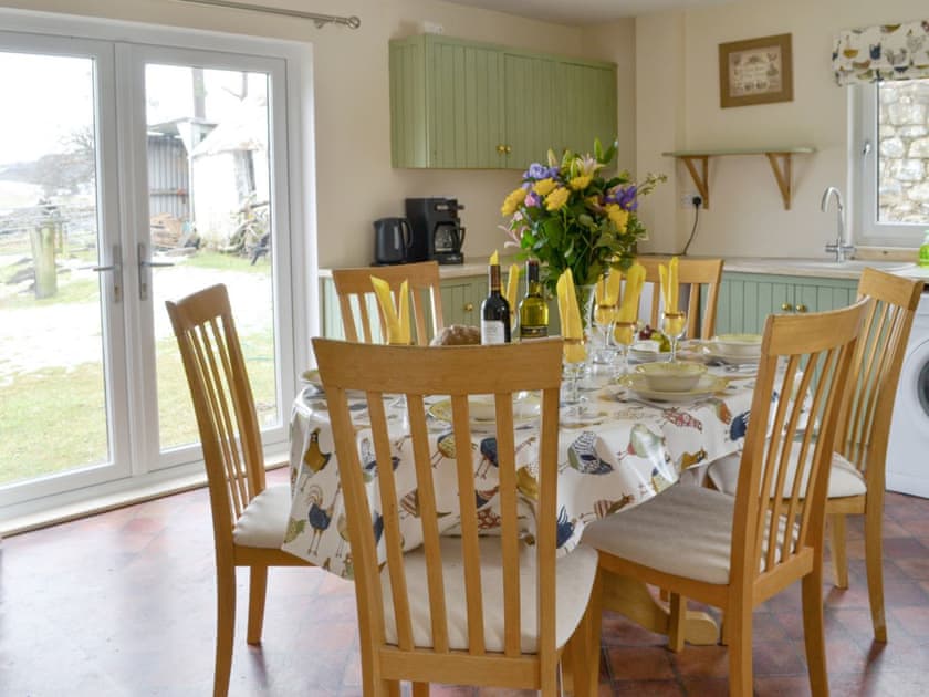 French doors from the kitchen lead into the garden | Foxhole Farm Cottage, Kiltarlity near Beauly