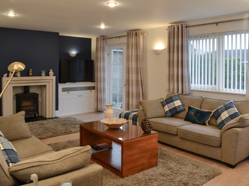 Thoughtfully furnished living room with wood burner | Blue Caps, Beadnell