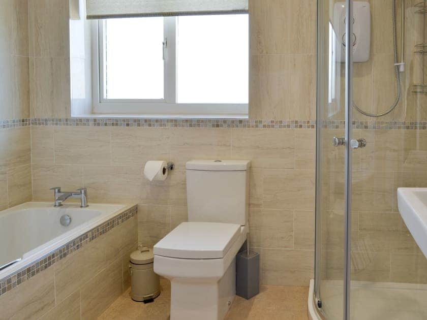 Family bathroom with bath and separate shower cubicle | No.19, Filey