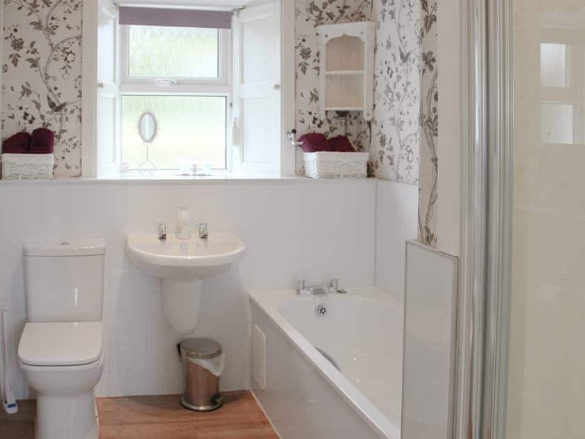 Bathroom with bath and separate shower cubicle | Palmallet Cottage, Whithorn