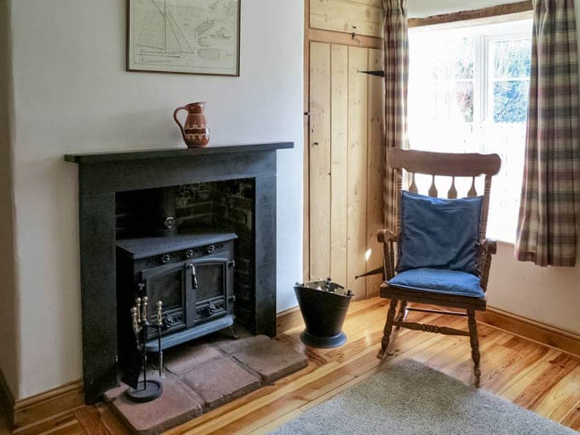 Welcoming living room with wood burner | Jenny&rsquo;s Cottage, Mundesley