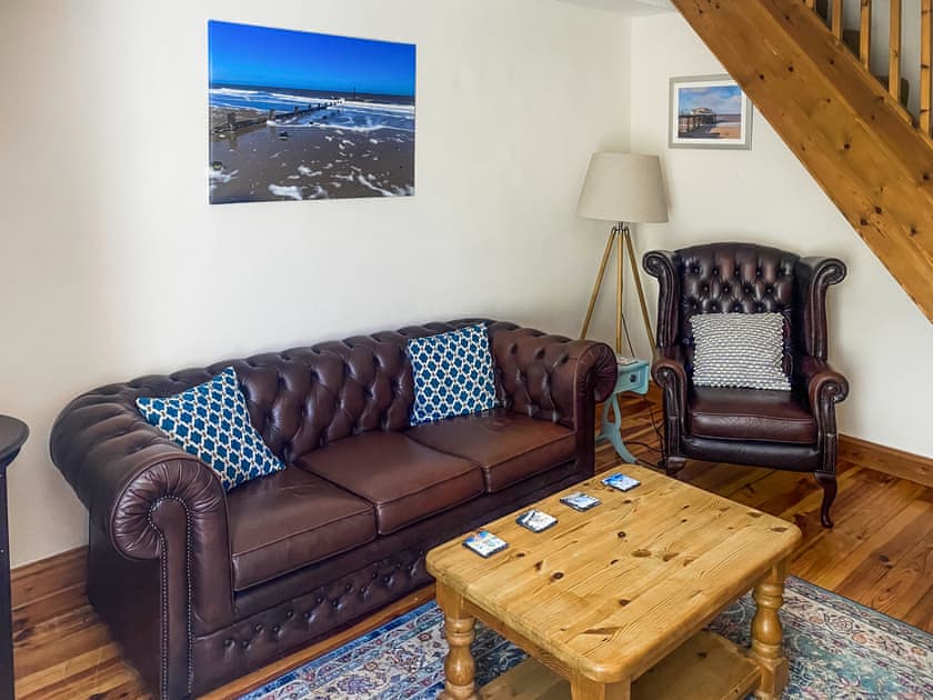 Comfy seating within living room | Jenny’s Cottage, Mundesley