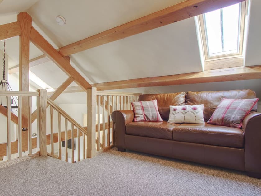 Comfy seating in Crog Loft | Fferam Gorniog, Holyhead Mountain, near Trearddur Bay
