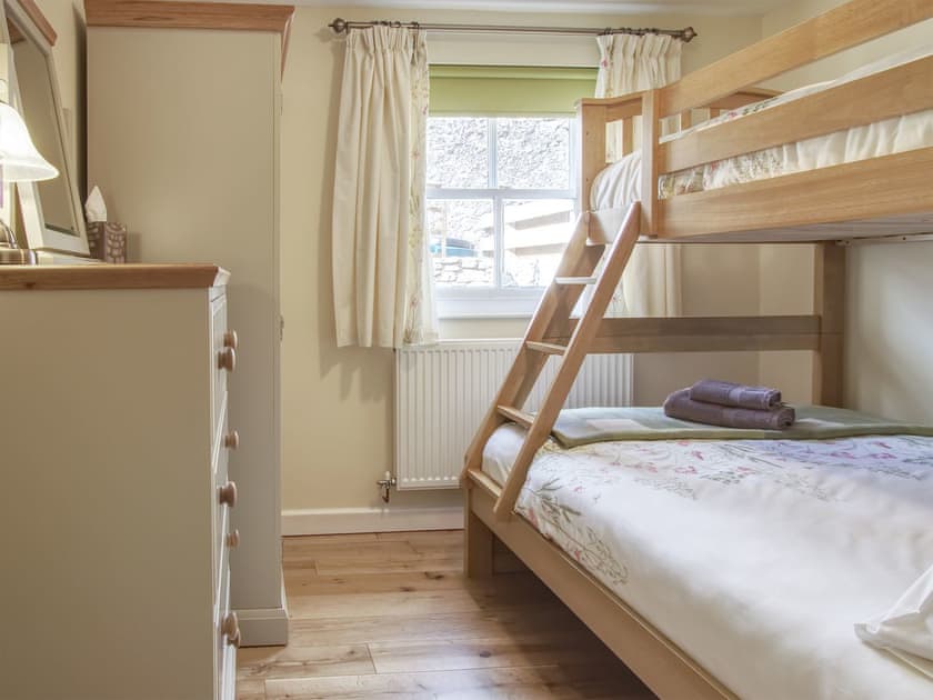 Relaxing bedroom with bunk bed that sleeps 3 | Fferam Gorniog, Holyhead Mountain, near Trearddur Bay
