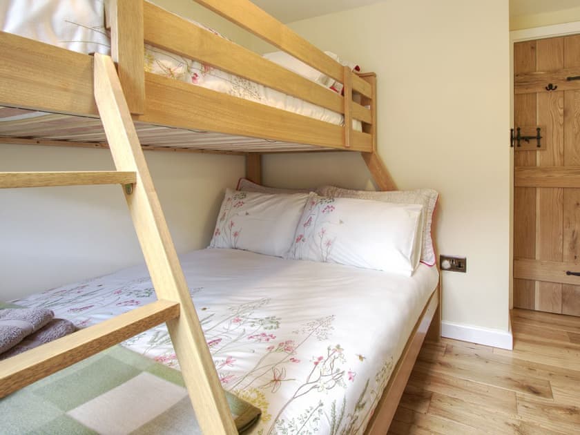 Relaxing bedroom with bunk bed that sleeps 3 | Fferam Gorniog, Holyhead Mountain, near Trearddur Bay