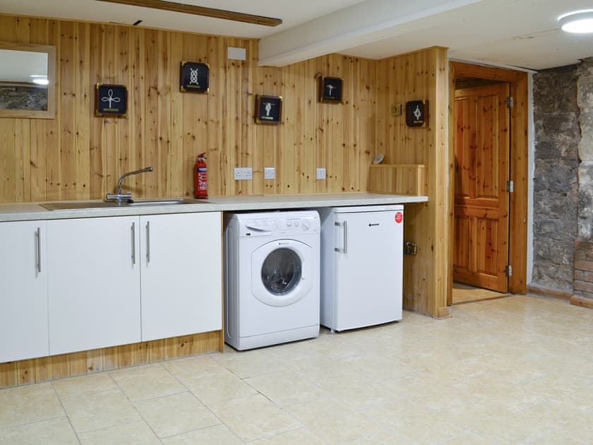 Large utility room with laundry and bike store | The Old Granary, Holy Island, near Berwick-upon-Tweed