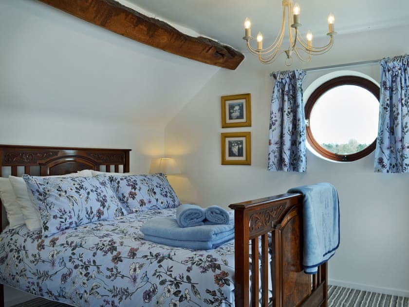 Elegantly decorated double bedroom with beams | The Beehive, Betley, near Nantwich