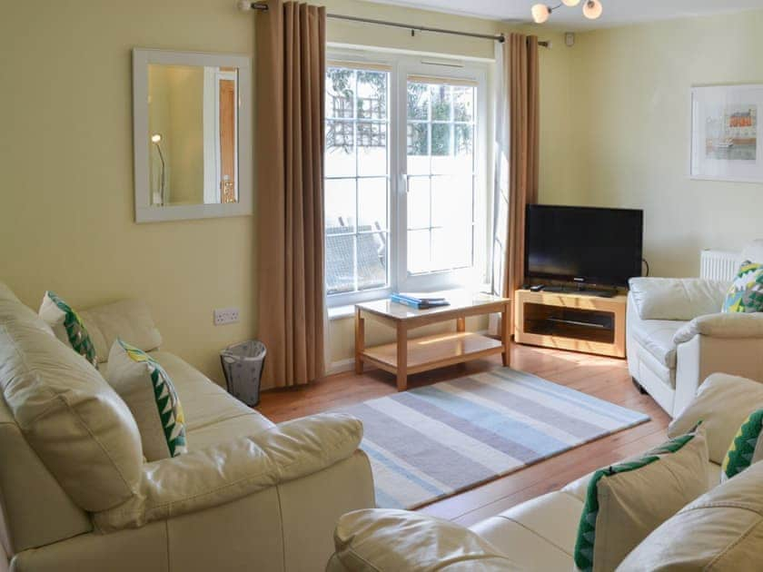 Lovely living room with French doors to the garden | North Shore, Crantock