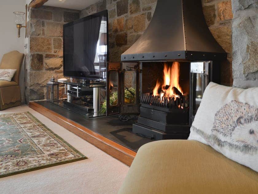 Relaxing living room with gas wood burner | Bodrydd - Bodrydd, Rhoshirwaun, near Pwllheli