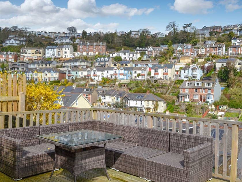 The decked area has modern patio furniture at which you can sit and have an al fresco meal whilst overlooking the town | Elm Grove, Dartmouth
