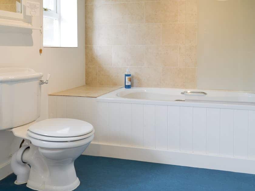 Family bathroom with shower over bath | Apple Tree Cottage, Near Holt