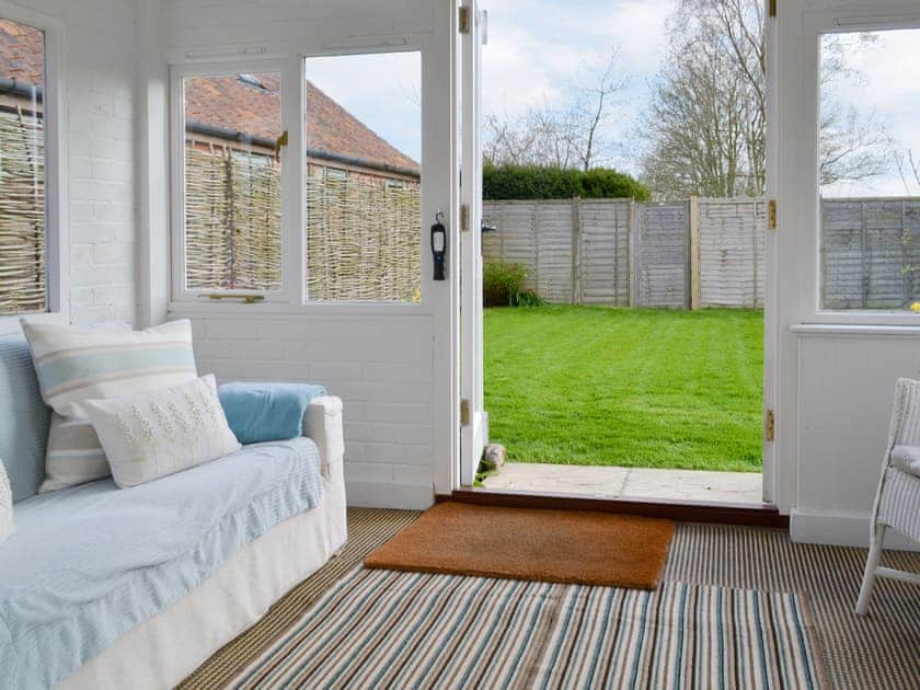 Additional seating area within the conservatory | Apple Tree Cottage, Near Holt