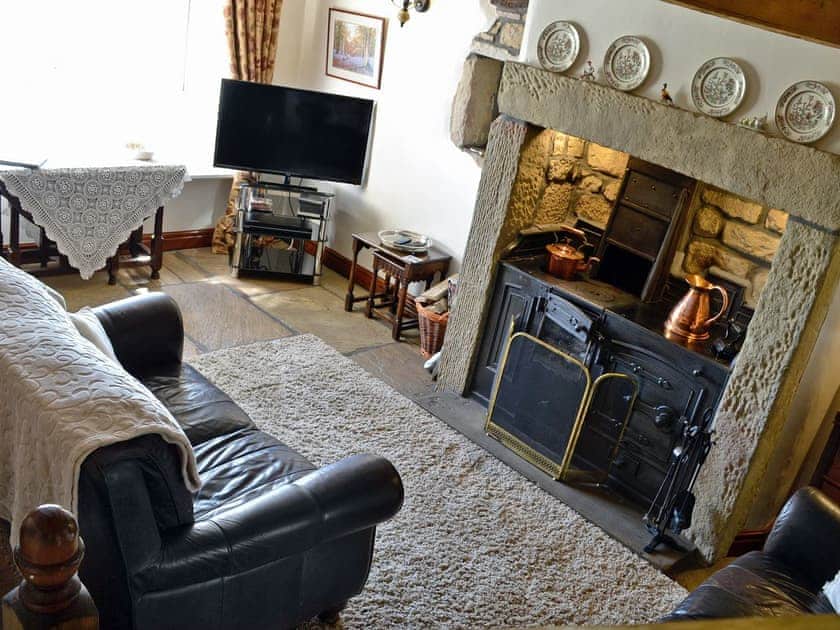 Warm and welcoming living room with open fire | Far View Cottage, near Haworth